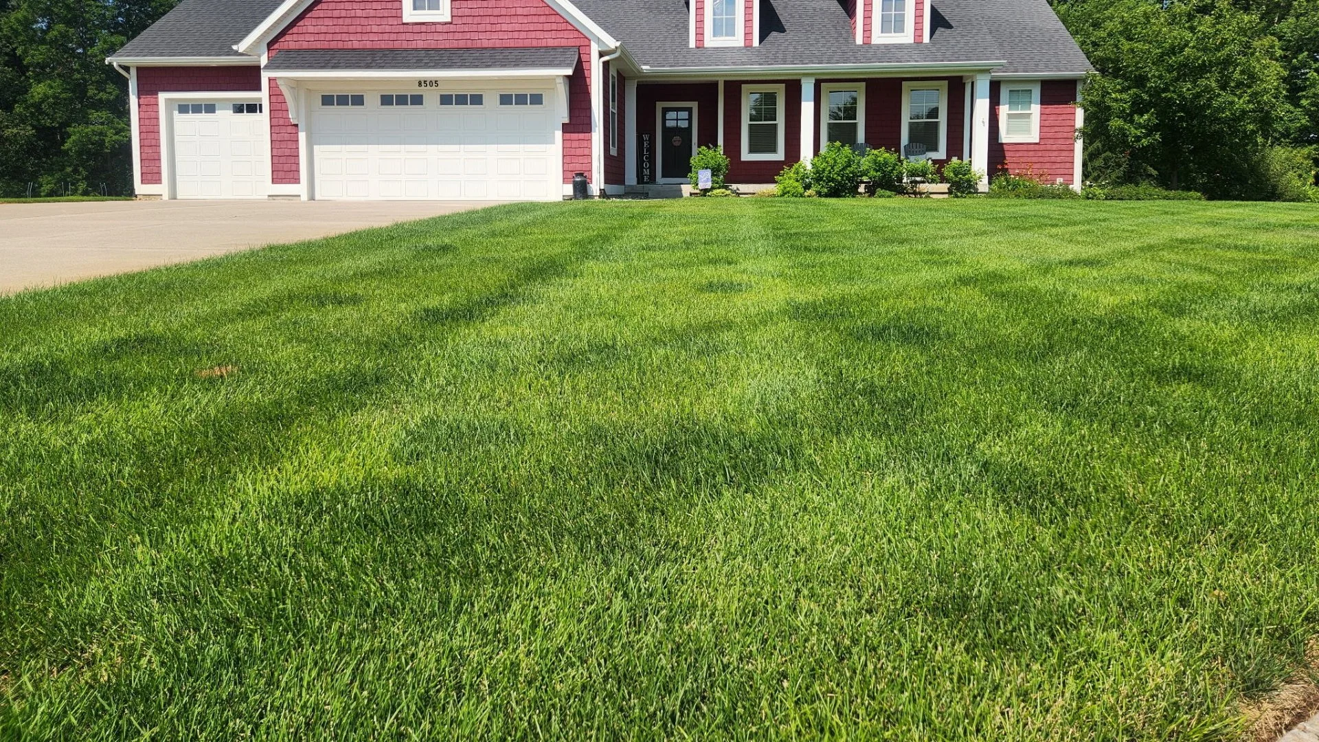Home in Grand Rapids, MI with green grass that's weed-free.