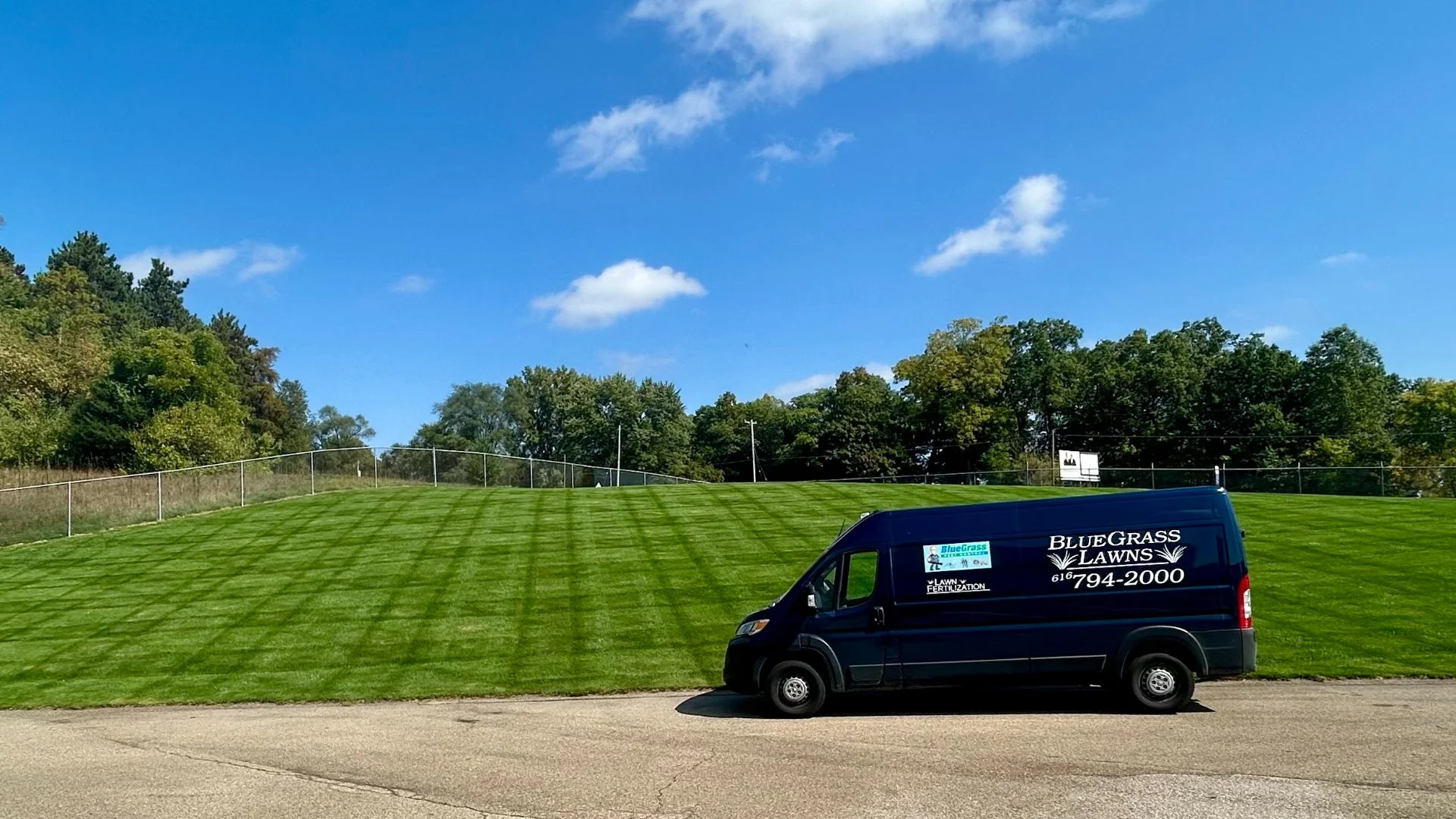 Home in Grand Rapids, MI with green grass that's weed-free.