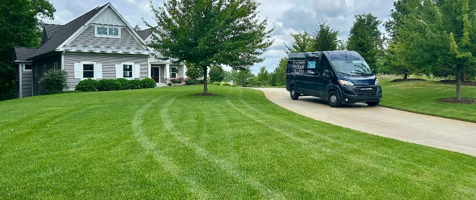 Spraying shrubs at home in Lansing, MI.
