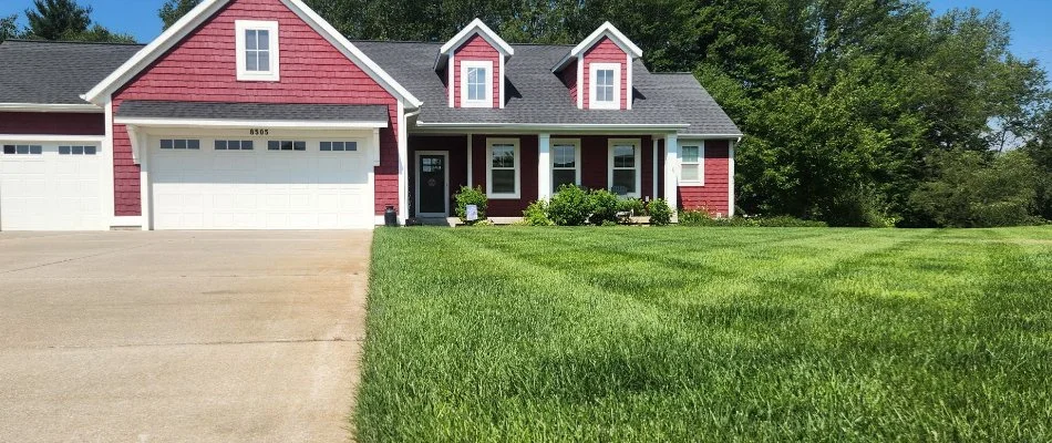 Healthy green lawn in Byron Center, MI, in front of a house.