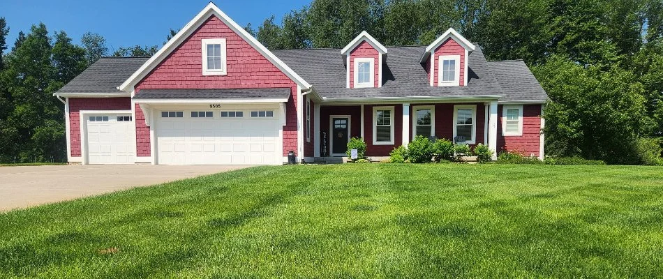 House in Grand Rapids, MI, with dense vibrant grass.