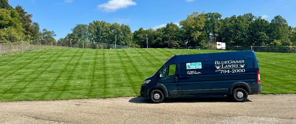 Van in front of a lawn in Waverly, MI.